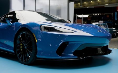 paint-protection-film-hero Clearshield pro paint protection film on a blue Mclaren in showroom.