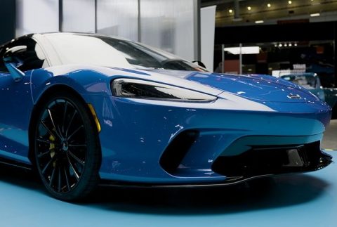 Clearshield pro paint protection film on a blue Mclaren in showroom.