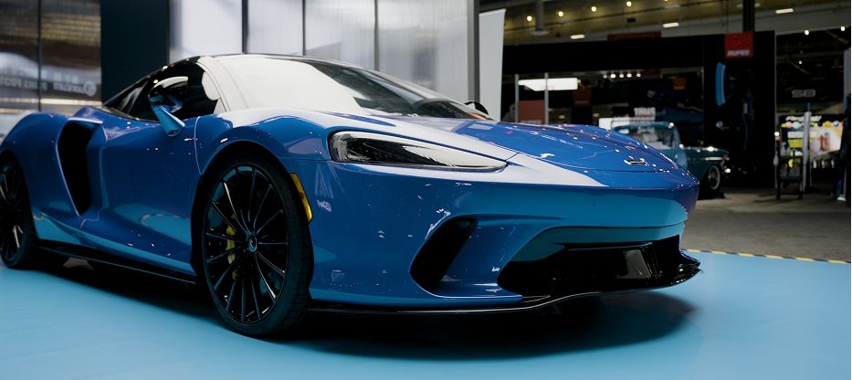 Clearshield pro paint protection film on a blue Mclaren in showroom.